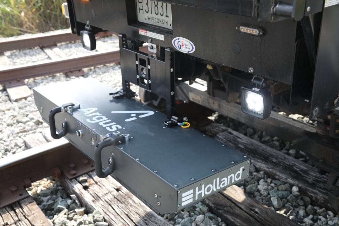 Argus Track Geometry Measurement system on the hitch of a pickup truck on railroad track.
